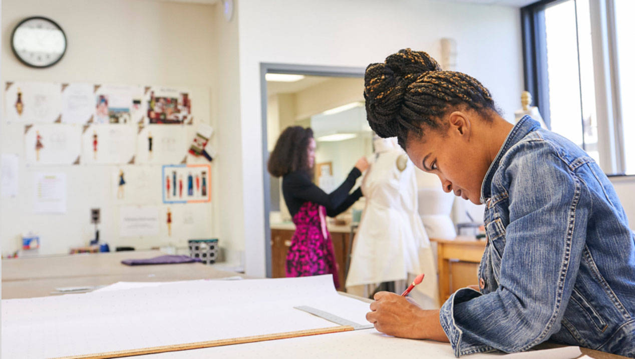 A Fashion Design student works on a project at Ursuline College