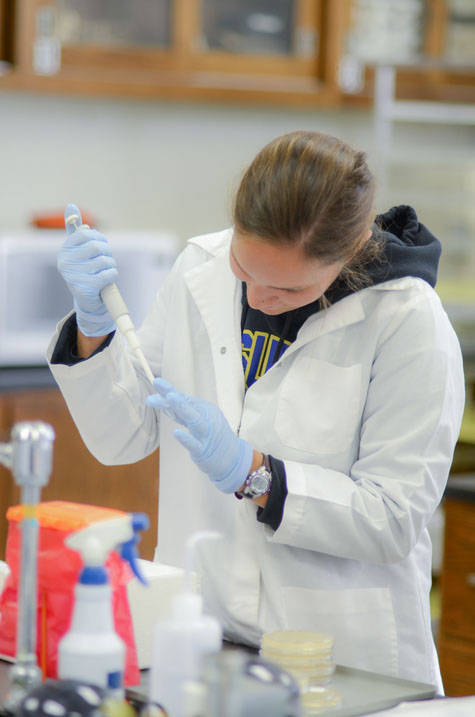 Biochemistry student works in lab