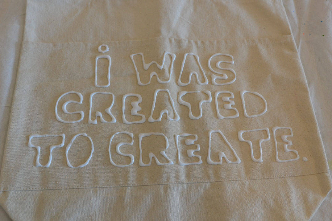 Fabric paint project art therapy program that reads: “I was created to create.”