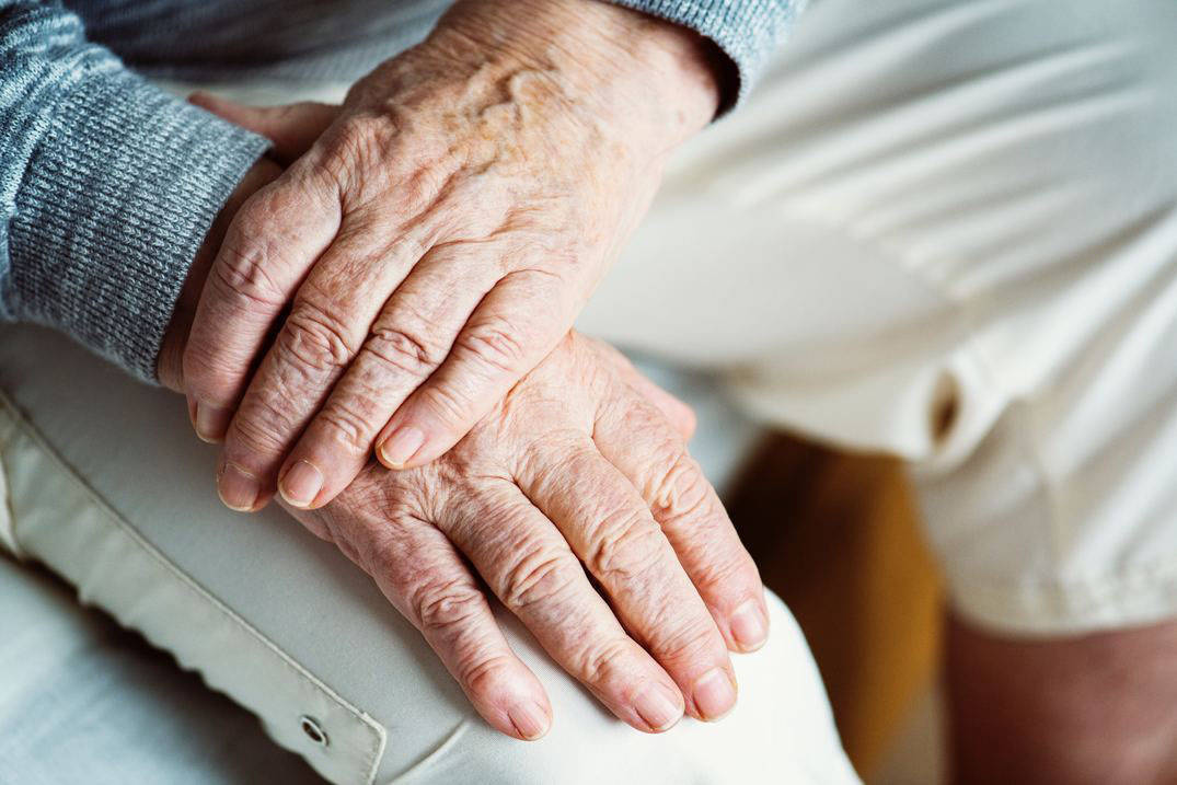 geriatric woman's crossed hands