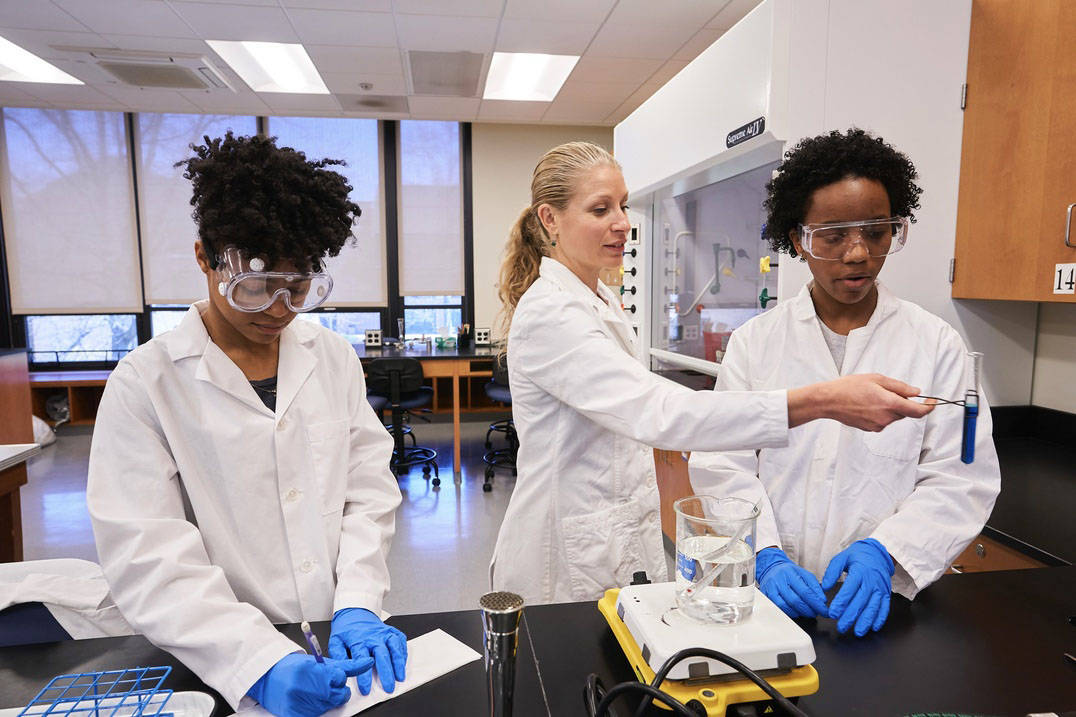 Students and faculty conduct experiments in a classroom at Ursuline College 