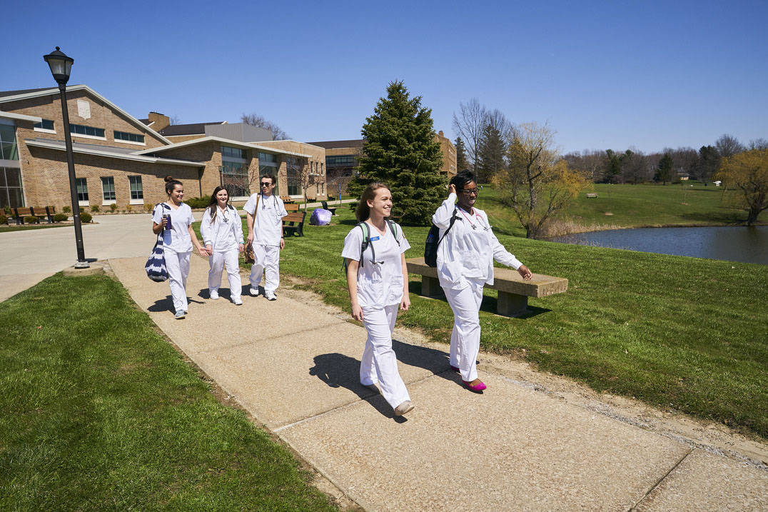 Nursing students walking on campus