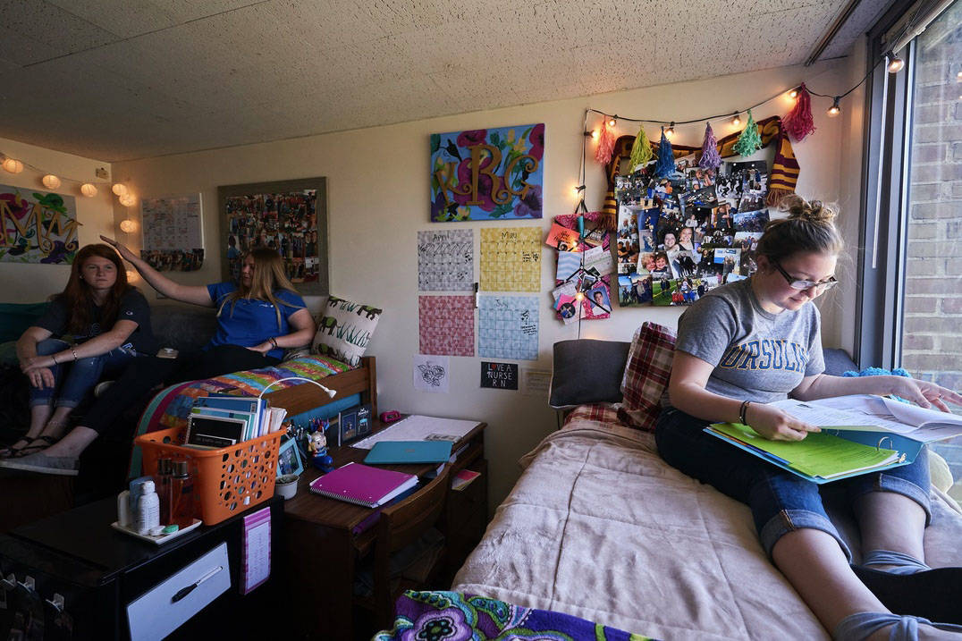 Roommates study in their residence hall room at Ursuline College